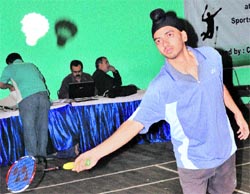 Rupinder plays a shot during a match of the Chandigarh State Badminton Championship in Chandigarh on Sunday