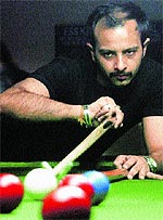 A player in action during a snooker match in Chandigarh on Sunday