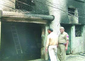 A police official at the Rajdhani Transport godown where the fire broke out in New Delhi on Sunday