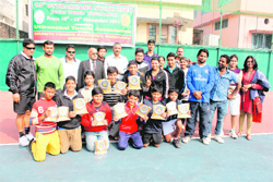 The winners of the 13th Uttarakhand Open State Junior Tennis Tournament in Dehradun on Sunday.