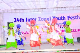 A bhangra team performs at the inauguration of a three day Inter-Zonal Festival at DAV College, Yamunanagar, on Sunday