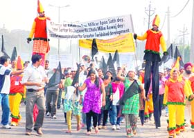 Residents of Greater Faridabad hold a protest march against builders and the state government at Ajronda Chowk in Faridabad on Sunday