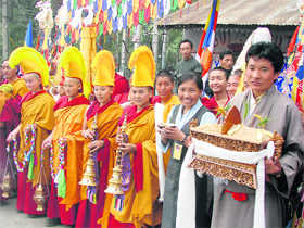 Tibetans wait to welcome their spiritual leader the Dalai Lama at Dharamsala on Sunday. 