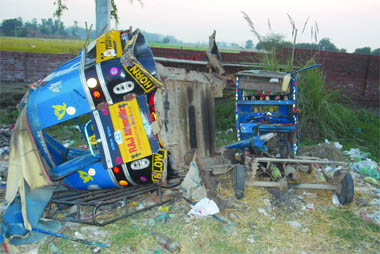 Mangled remains of an auto-rickshaw which was hit by a truck on the Ram Tirath Road in Amritsar on Sunday. 