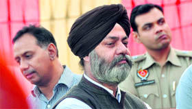 Ishmeets father stands aloof during the opening of the institute in Ludhiana on Sunday.