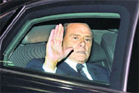 Italian PM Silvio Berlusconi leaves the Quirinale Presidential Palace after meeting President Giorgio Napolitano, in Rome, on Saturday