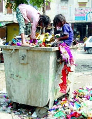 Childrens Day has no meaning for them: Two minor ragpickers carry on as usual near the IDH market in Amritsar.
