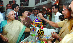 Chief Minister Sheila Dikshit at a stall of Delhi Pavilion on the first day of the IITF in New Delhi on Monday.