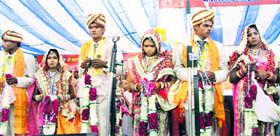 A group photo of couples whose marriages were solemnised at Hari Mandir Ashram in Pataudi, Rewari.