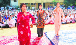 Students perform during the Childrens Day celebrations at Government Higher Secondary School in Jammu on Monday