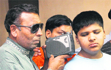 Visually challenged Atma Ram listens to the radio along with the students of Rashtriya Andh Vidyalaya in Jalandhar. 