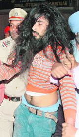 A SAD (A) activist being taken away for raising slogans during Advanis yatra in Amritsar.