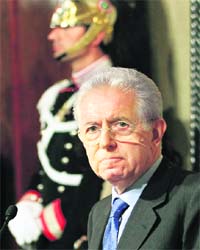 Italys newly appointed Prime Minister Mario Monti speaks to reporters following a talk with President Giorgio Napolitano at the Quirinale Palace in Rome