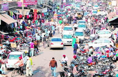 The haphazard parking of vehicles on the railway link road hinders the smooth flow of traffic in Amritsar. 