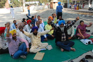 The laboratory technicians staging a dharna on the premises of the Civil Hospital in Bathinda on Tuesday. 