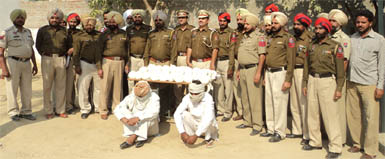 Police with the arrested panchayat member Mohal Singh and his nephew Amarjit Singh. 