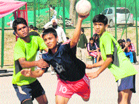 A player of Guru Nanak Khalsa School, Sector 30, in action against GMSSS-23 during the Inter-School Handball Tournament at Sports Complex, Sector 42, Chandigarh