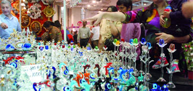 People purchase glass items at the Turkish stalls during the India International Trade Fair-2011 at Pragati Maidan in New Delhi on Tuesday.