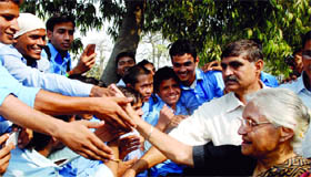 Delhi Chief Minister Sheila Dikshit meets schoolchildren during the laying of the foundation stone of a women wing at ITI, Nand Nagar, on Tuesday.