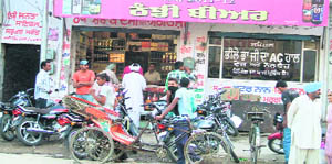 Liquor buyers queue up outside a vend in Mansa. 
