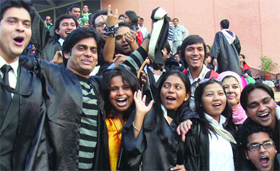 Students of Jamia Millia Islamia rejoice after getting their degrees on the convocation day in New Delhi on Wednesday.