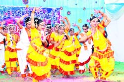 Students present a cultural show during an inter-school dance competition held at SGRR School in Dehradun 