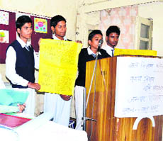 Children present their projects on land resources at the Bal Bhavan in Haridwar on Wednesday. 
