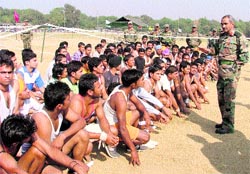 Brig Vinod Raizada gives tips to aspirants during an Army recruitment rally in Ludhiana on Wednesday