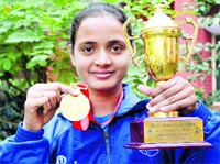 Nainy Balla poses with her trophy and gold medal in Ludhiana