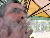 A man puffs a cigarette at a public place in Ludhiana