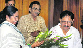 Mamata Banerjee being greeted by Opposition Leader and CPM member Surya Kanata Mishra after she took oath as a member of the West Bengal Legislative Assembly in Kolkata on Wednesday. 