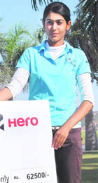 Nalini Singh Siwach with the winners cheque at the Panchkula Golf Course on Wednesday. 