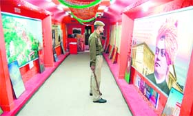 A policeman on duty views posters in the Vivek Express in Amritsar