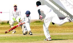 A batsman plays a shot during a match of the Inter-School Cricket Tournament in Chandigarh on Thursday