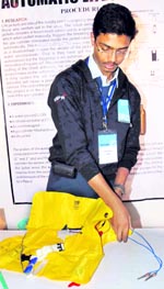 Student with his innovative life- saving jacket at the IRIS event at PEC, Chandigarh, on Thursday