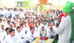 INLD supremo Om Prakash Chautala addresses a village meeting in support of party nominee Sarfi Bai at Ratia on Thursday.