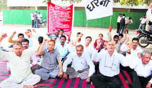 Haryana Tourism employees hold a dharna in support of their demands at Shama restaurant in Gurgaon