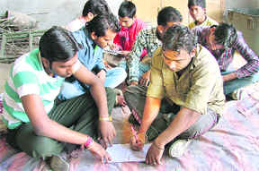 An auto-rickshaw driver at a class organised under Adult Literacy Campaign