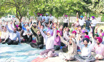 Engineers of Punjab State Power Corporation Limited and Punjab State Transmission Corporation Limited stage a protest in support of their demands in Ludhiana on Thursday