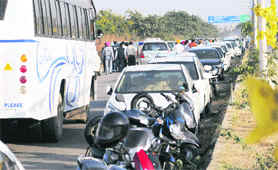 Vehicles stuck in a traffic jam outside a marriage palace, where the Youth Akali Dal had organised a function, on the Pakhowal road in Ludhiana on Thursday