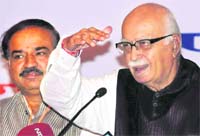 BJP leader LK Advani addresses a press conference in Chandigarh on Thursday. Karnataka MP Ananth Kumar is seated on his right