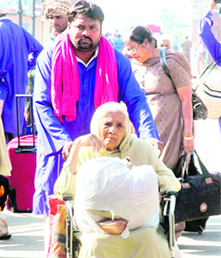 Pilgrims after their return from Pakistan at the Wagah check post in Amritsar on Thursday. Tribune photo