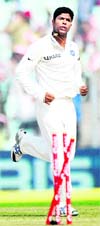 Umesh Yadav (R) celebrates after taking the wicket of West Indies Shivnarine Chanderpaul (L) during the fourth day of the second Test at The Eden Gardens in Kolkata on Thursday. India now lead the 3 match Test series 2-0. 