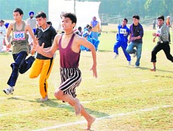 Visually impaired children participate in  a race (above) at Guru Nanak Dev University in Amritsar on Friday
