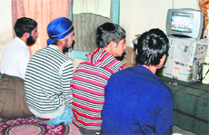 Inmates watch TV at Juvenile Home at RS Pura in Jammu.