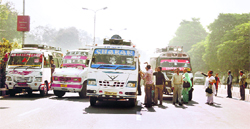 Minibus operators park their vehicles on the busy BC Road in Jammu, causing traffic jams and snarls.