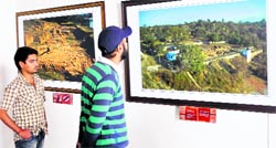 Visitors at a photo exhibition on Akhnoor at Kala Kendra in Jammu