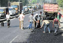 The re-laying of one side of the road on the DAV railway overbridge leads to a traffic jam on the other side in Jalandhar on Friday