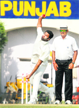 Punjabs Manpreet Gony bowls during their Ranji Trophy match against Saurashtra at the PCA Stadium in Mohali on Friday.
