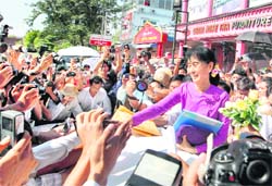 Myanmars democracy leader Aung San Suu Kyi outside her party headquarters in Yangon